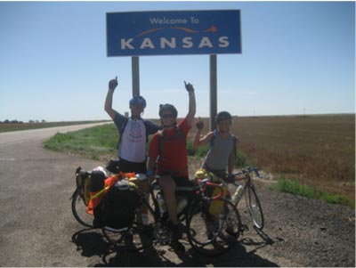 in front of kansas sign on bikes